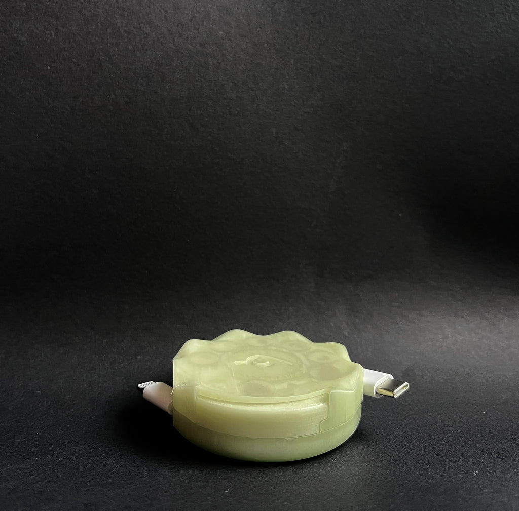 Glow in the Dark ghost pebble. Automatic cable organiser. 